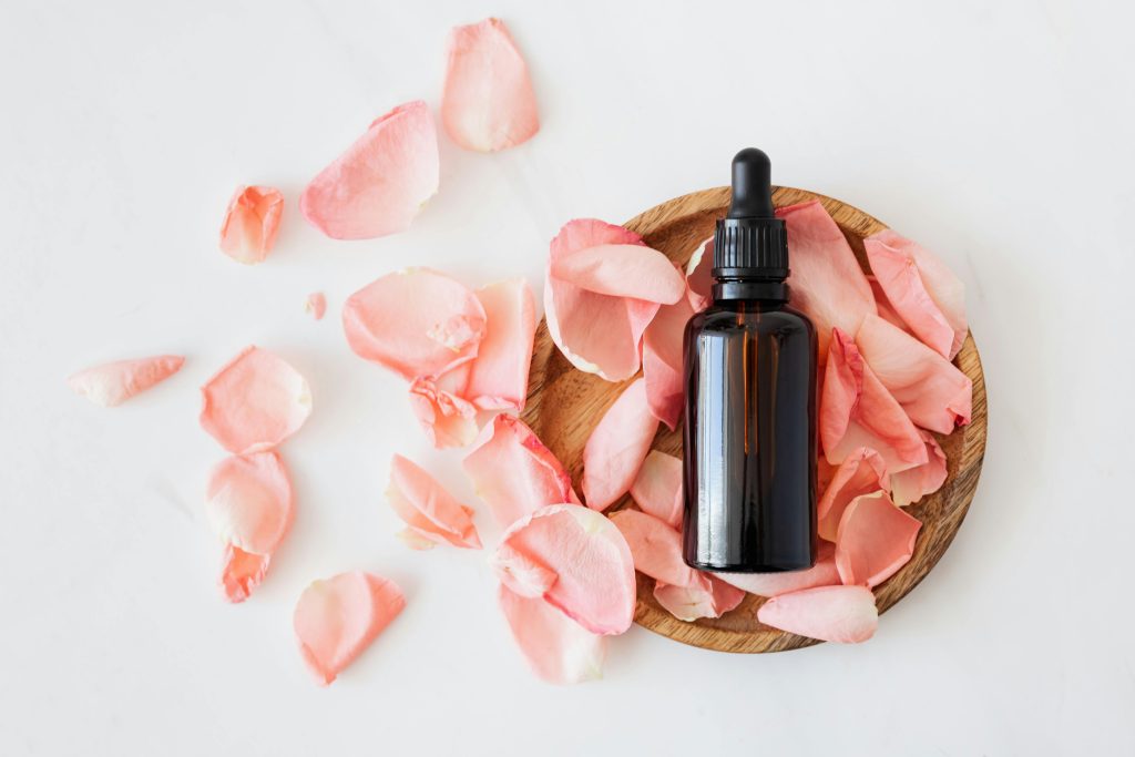 oil in basket and rose petals