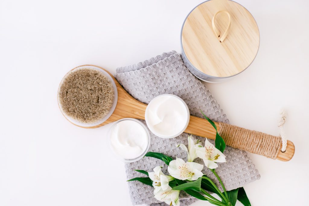 bath brush, flowers, cream